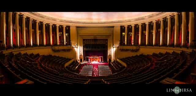 Grand auditorium with tiered seating, perfect for conferences and performances.
