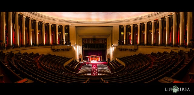 Grand auditorium with tiered seating, perfect for conferences and performances.