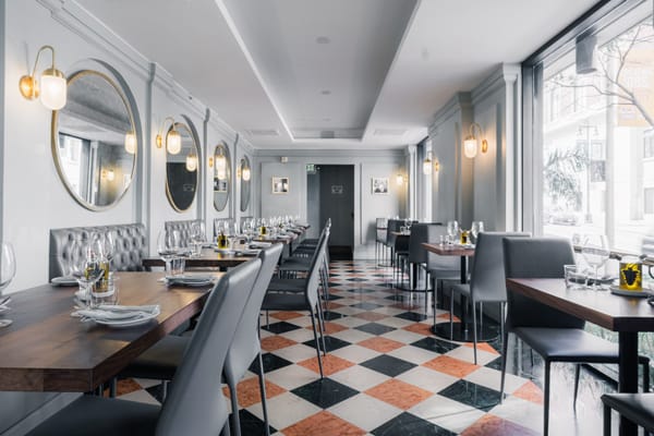 Elegant restaurant interior with soft lighting, perfect for intimate gatherings and corporate events.