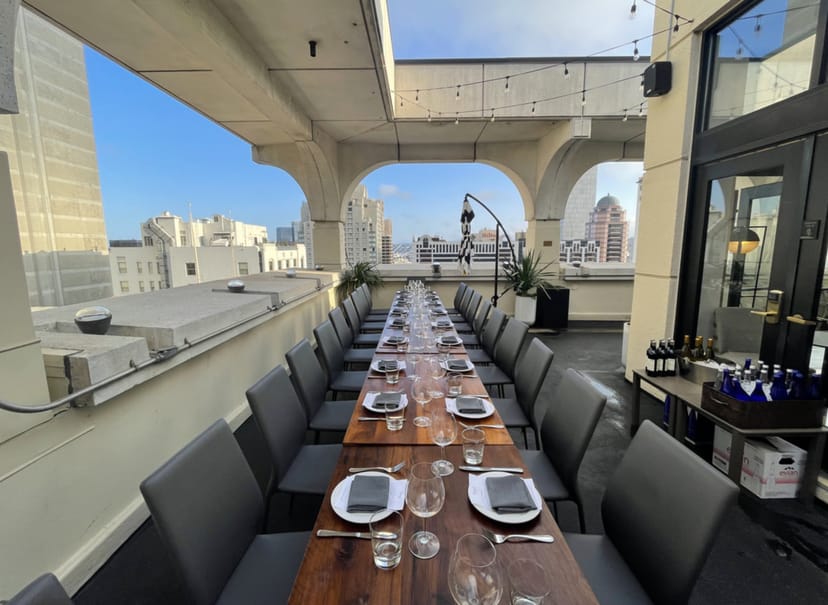 Stylish rooftop venue in Zingari with elegant table setup for upscale events.