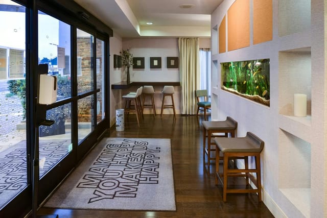 Welcoming Hampton Inn lobby with natural light, ideal for meetings and events.