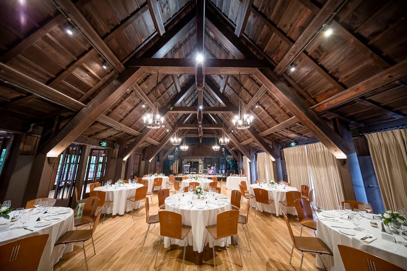 Elegant reception hall with round tables, perfect for weddings and corporate events.