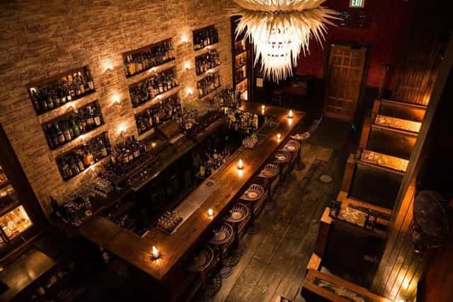 Stylish bar with warm lighting, perfect for cocktail receptions and networking events.
