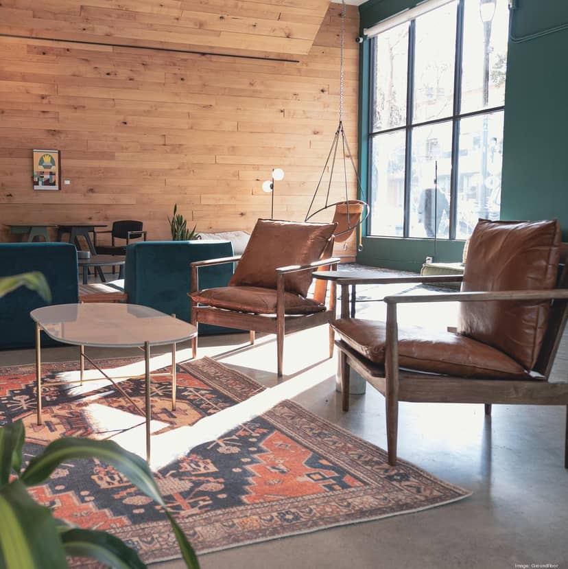 Stylish lounge area with leather chairs for networking events at Groundfloor Club.