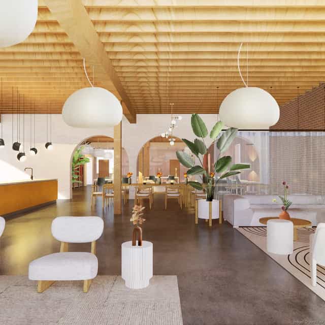 Modern event space with natural light, comfortable seating for meetings and gatherings.