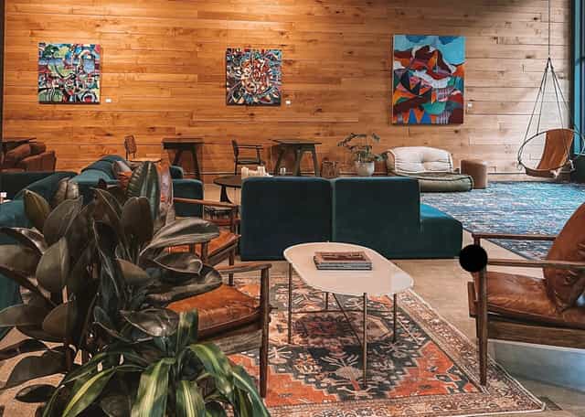 Wellness Space lounge with wooden walls, ideal for networking events and meetings.