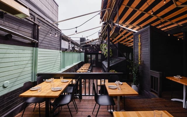 Stylish outdoor dining table in Fiorella for gatherings and networking events.