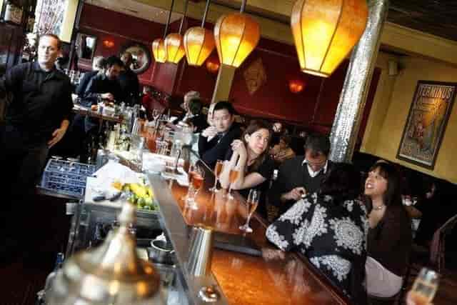 Absinthe Brasserie & Bar with warm lighting, perfect for networking and social gatherings.