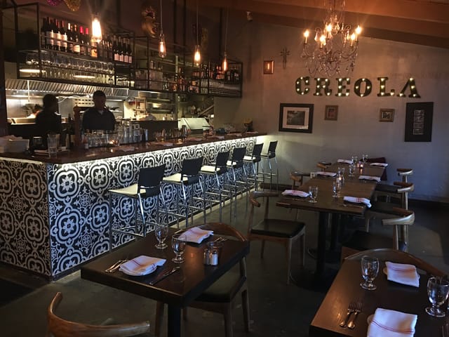 Stylish bar at CreoLa Bistro, perfect for intimate gatherings and corporate events.