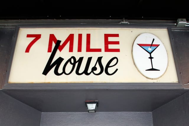7 Mile House venue sign with cocktail glass, perfect for casual networking events.