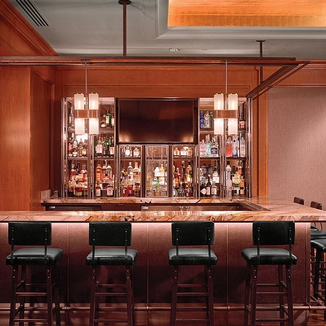 MKT Restaurant bar with polished marble, ideal for networking events and cocktail receptions.