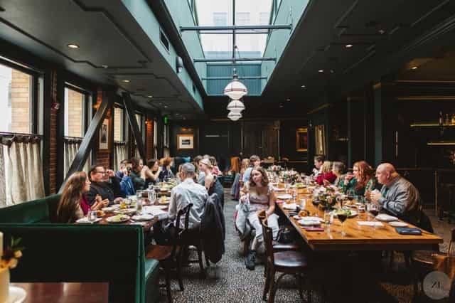 Elegant dining setup in Wayfare Tavern's Billiards Room for corporate networking event.
