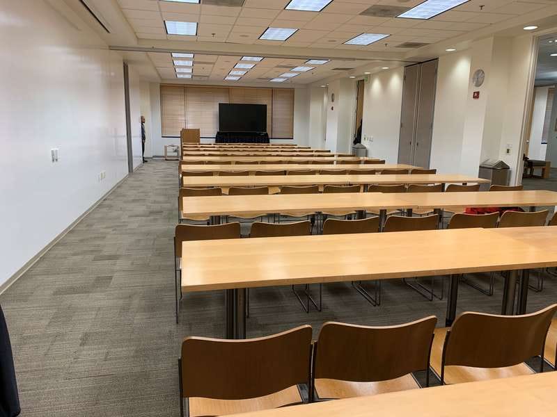 Stanford Conference Room with long tables, ideal for workshops and seminars.