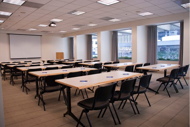 Stanford Conference Room with classroom setup for workshops and training sessions.