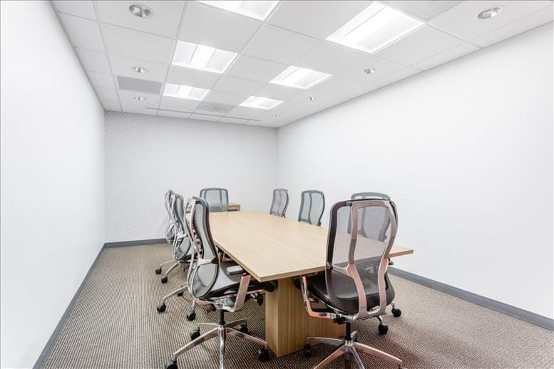 Minimalist conference room with spacious table for professional meetings at 1390 Market Street.