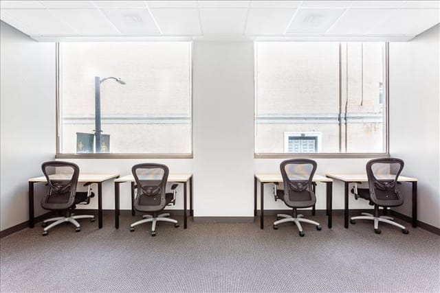 Minimalist meeting room with ergonomic chairs, ideal for collaborative sessions.