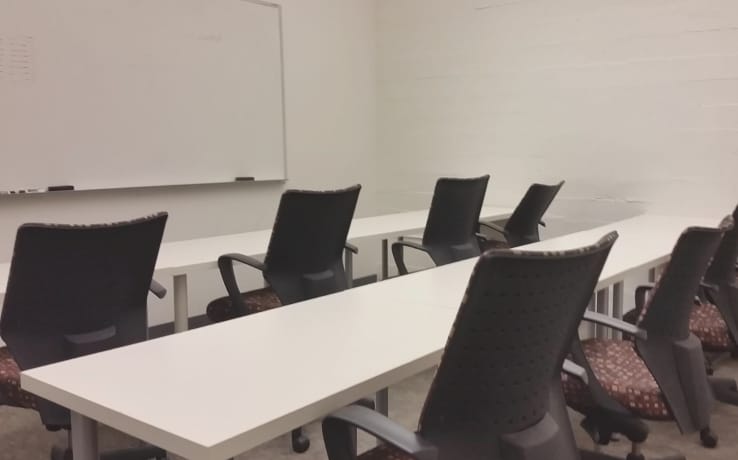 Minimalist conference room in SOMAcentral, ideal for workshops and group discussions.