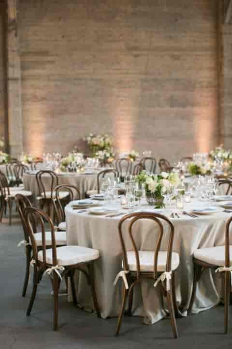 Elegant event space with round tables and floral centerpieces in Downey Street.
