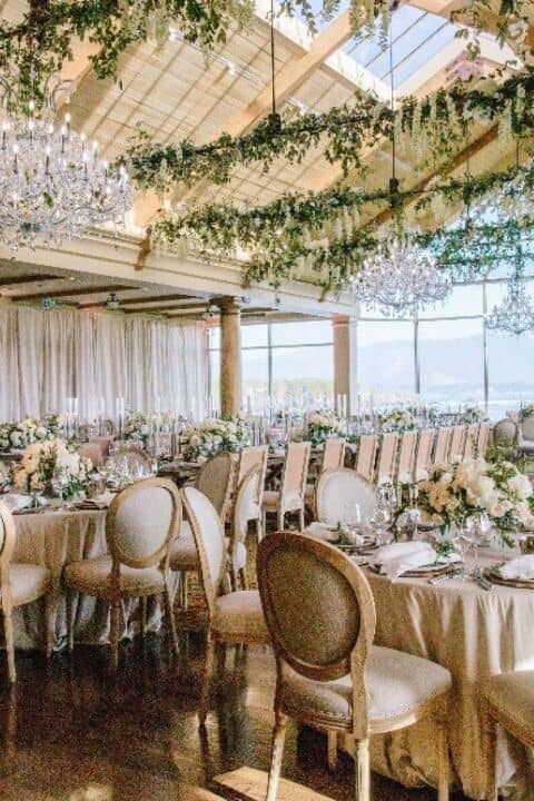 Elegant event space with chandeliers, perfect for weddings and upscale gatherings.
