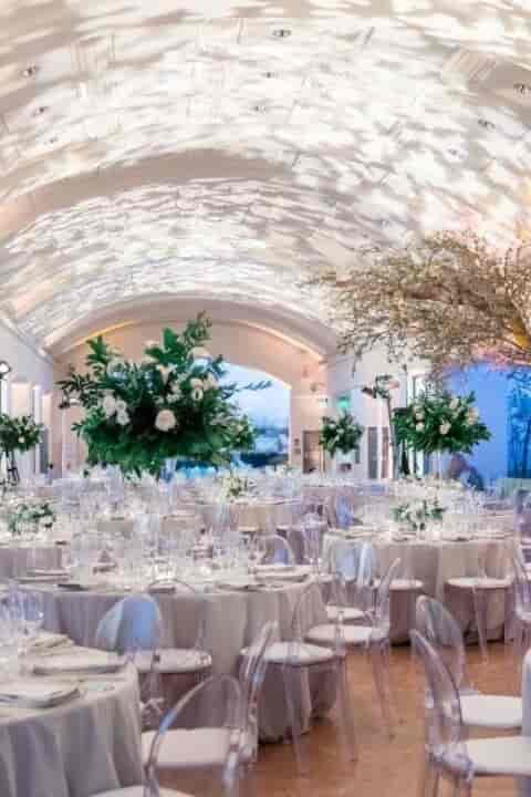 Elegant event space with floral arrangements, ideal for weddings and upscale gatherings.