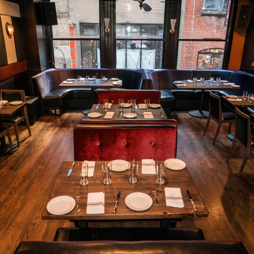 Stylish restaurant patio with elegant seating for intimate gatherings and corporate events.