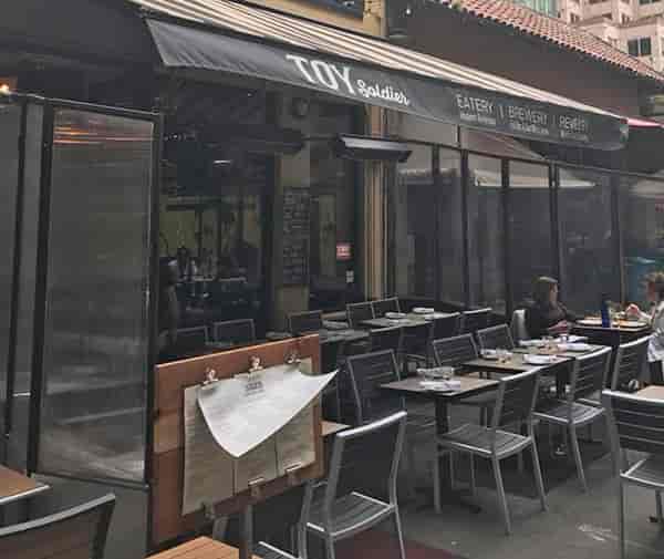Vibrant outdoor dining patio at Toy Soldier, perfect for casual meetings and events.