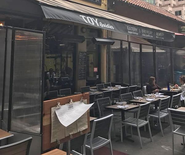 Vibrant outdoor dining patio at Toy Soldier, perfect for casual meetings and events.