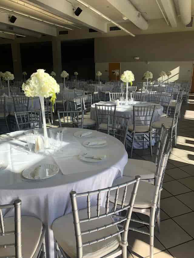 Elegant event space at Donworth Hall with floral centerpieces, perfect for weddings and galas.