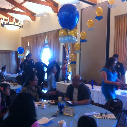 Colma Community Center event with colorful balloons and engaged attendees.