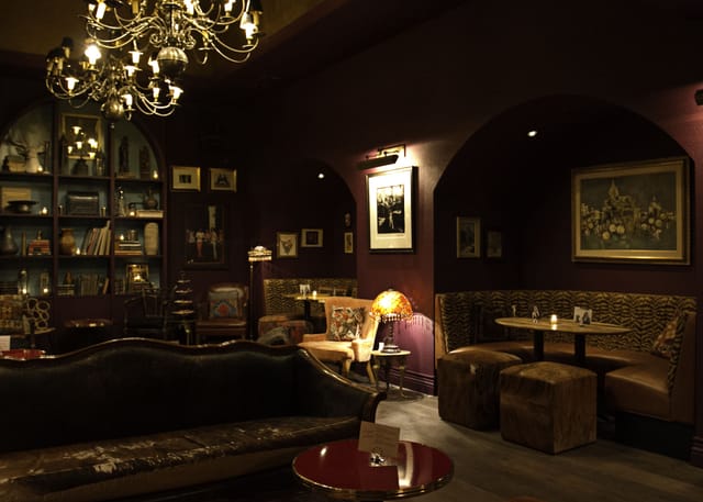 Cozy Speakeasy lounge at The Cavalier, perfect for intimate meetings and networking events.