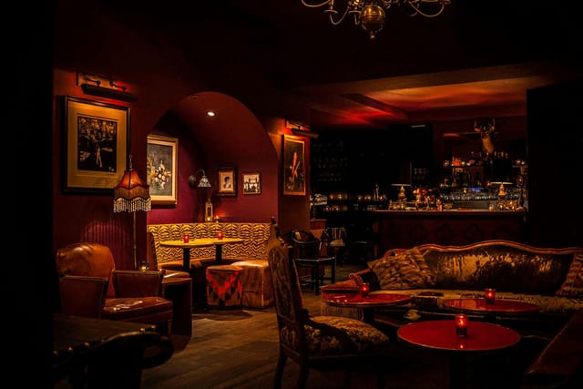 Stylish speakeasy venue with warm lighting for upscale events and private gatherings.