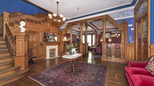Elegant event space in Chateau Tivoli with rich wood architecture for upscale gatherings.