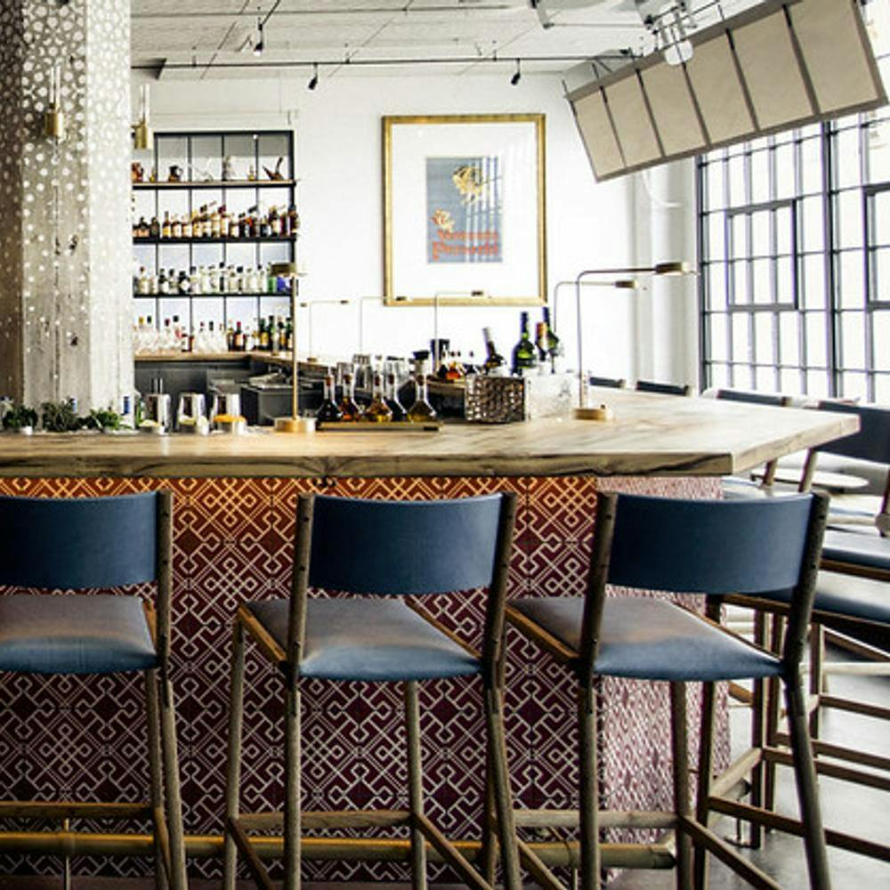 Stylish bar in Bellota SF, ideal for networking events with warm lighting and casual seating.