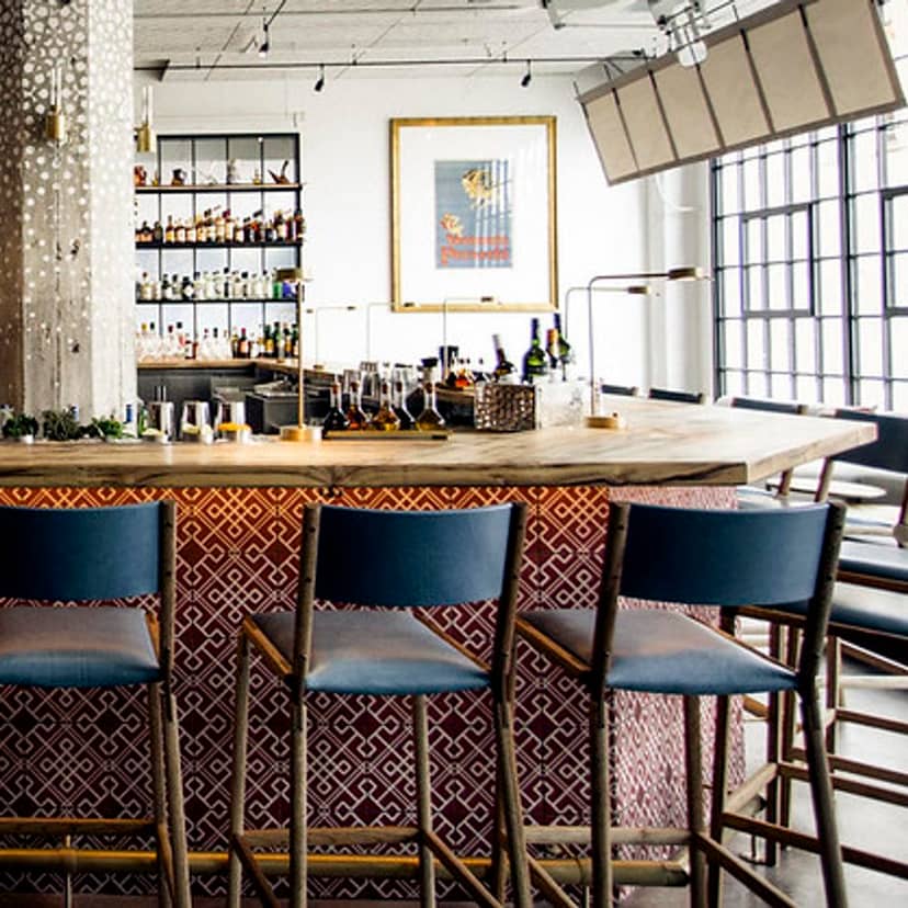 Stylish bar in Bellota SF, ideal for networking events with warm lighting and casual seating.