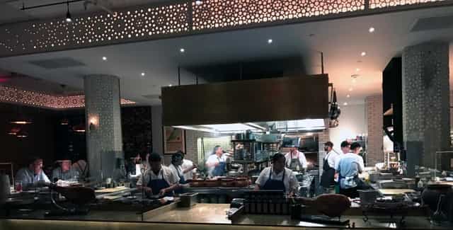 Bellota SF kitchen showcasing chefs in action for interactive dining events.