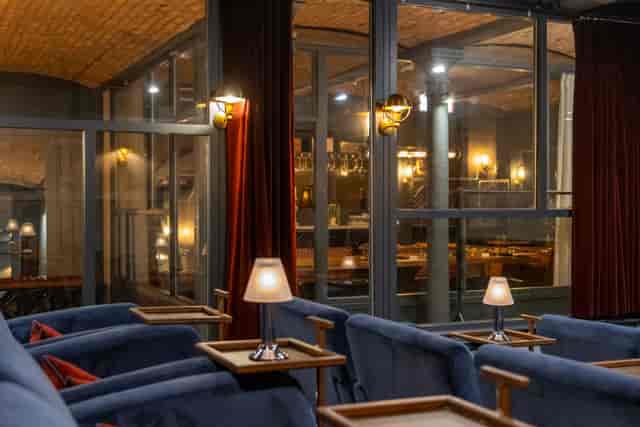 Sophisticated event space with plush seating at The Cellars, ideal for gatherings and networking.