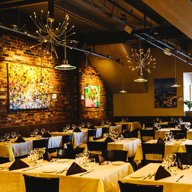 Stylish Marzano Restaurant with warm brick walls, perfect for intimate gatherings and corporate events.