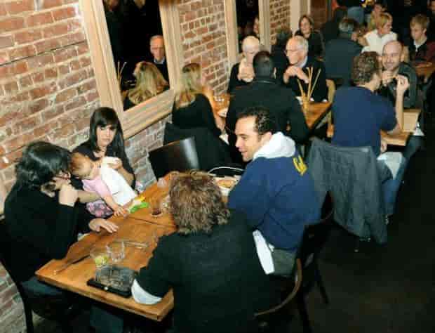 Lively Marzano Restaurant with brick walls, perfect for networking events and gatherings.