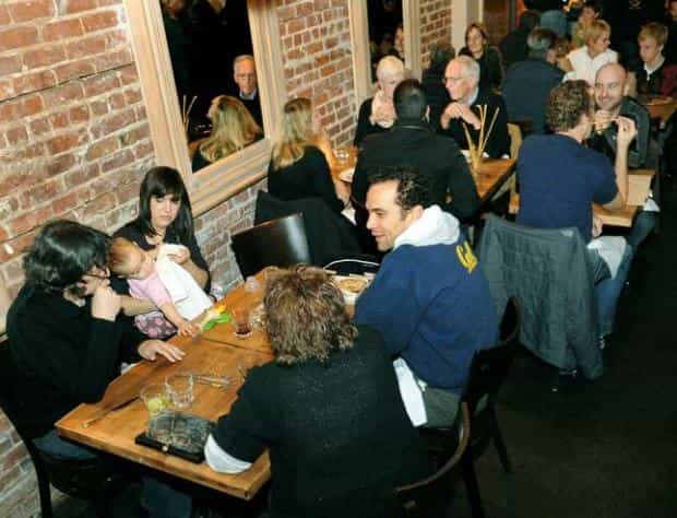 Lively Marzano Restaurant with brick walls, perfect for networking events and gatherings.