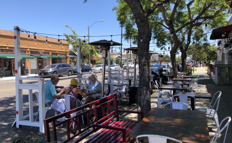Outdoor parklet at Marzano Restaurant with seating, ideal for casual meetings and networking.