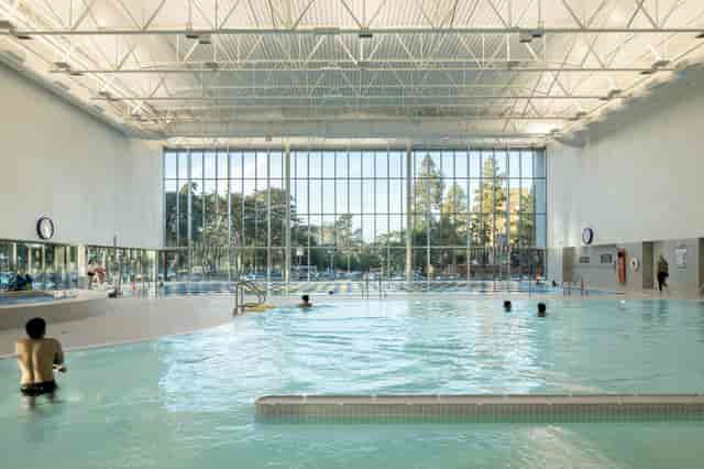 Spacious indoor pool at Sima Space wellness center for retreats and fitness events.