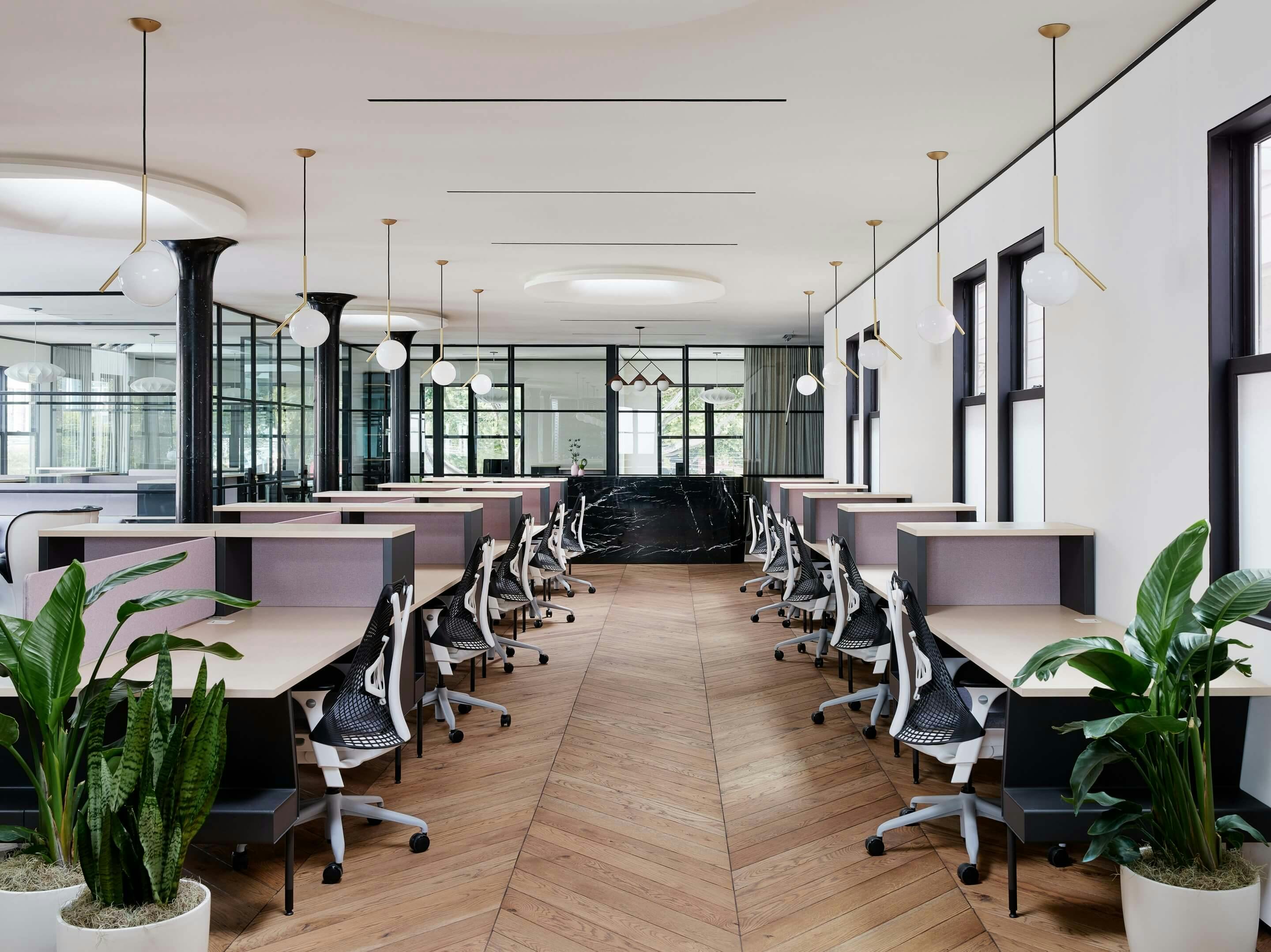 Modern private office space with ergonomic chairs for coworking and team meetings.