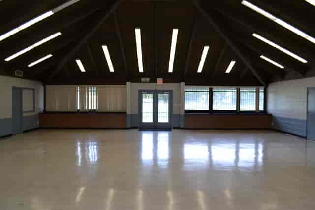 Gellert Park Clubhouse meeting room with high ceilings for community events and workshops.