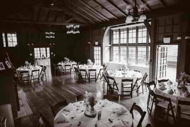Julia Morgan Hall event space with round tables and floral centerpieces for gatherings.