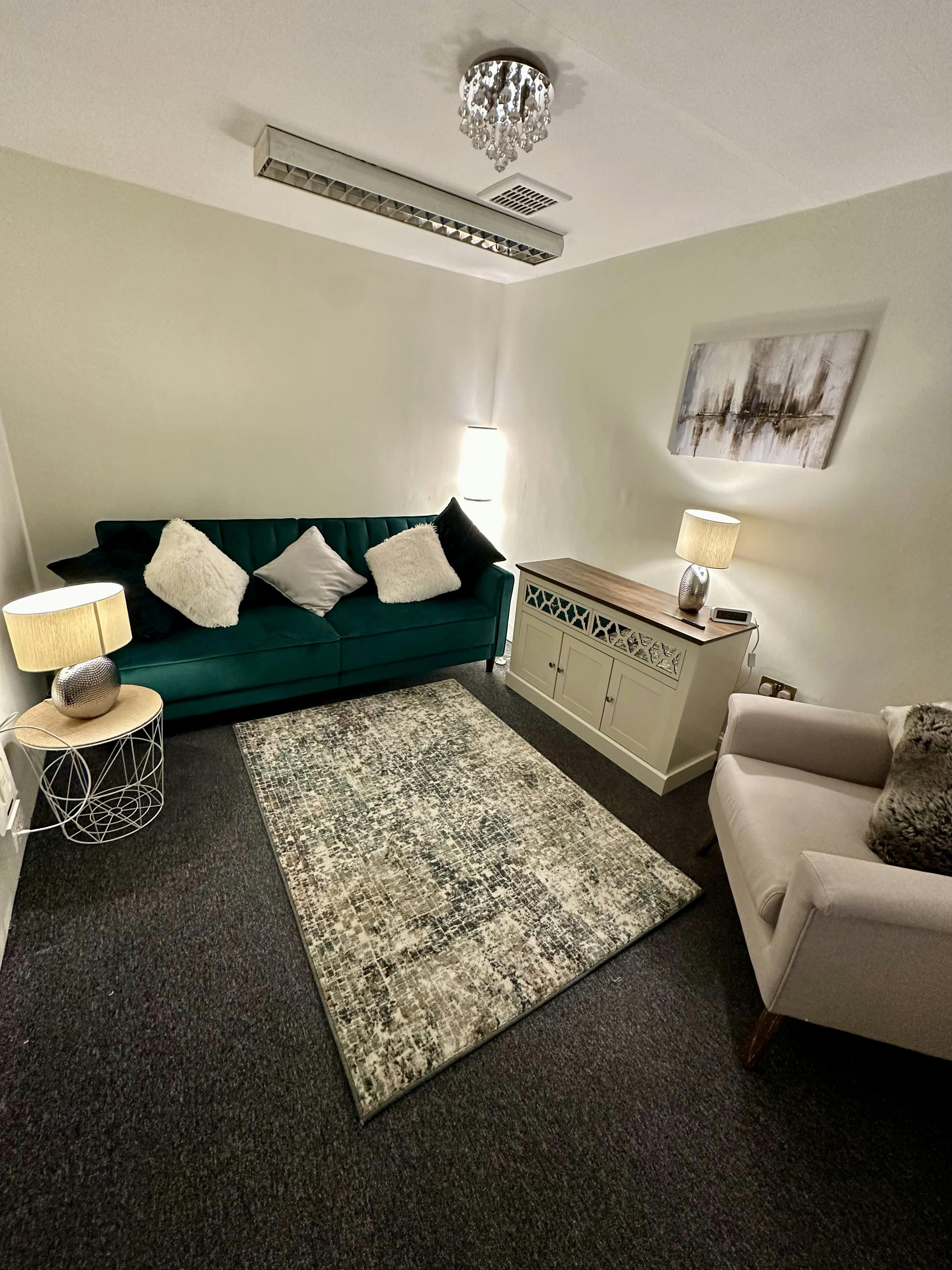 Cozy meeting space in The Pilgrim Suite, perfect for informal discussions and gatherings.