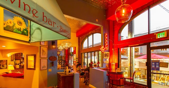 Cozy Aquitaine Wine Bistro with warm lighting, ideal for networking events and gatherings.