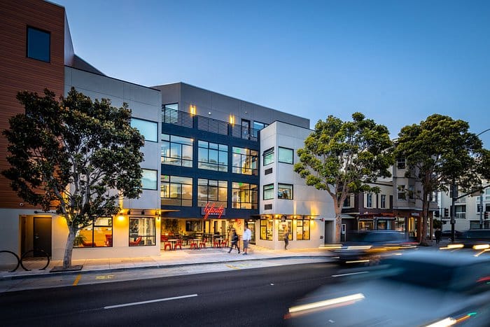 Modern event venue APT 11 with large windows, perfect for corporate meetings and social events.