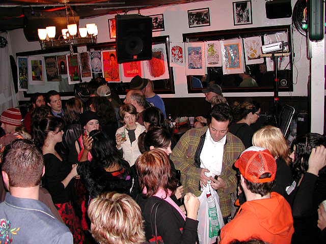 Lively networking event at Coffee in Thee Parkside with vibrant decor and warm lighting.