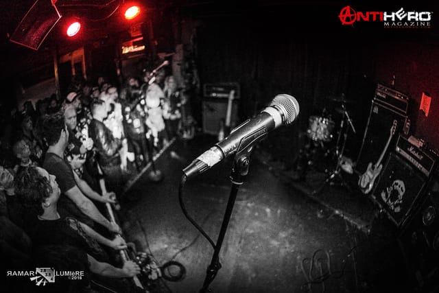 Small stage at Thee Parkside with microphone, vibrant live music event audience.