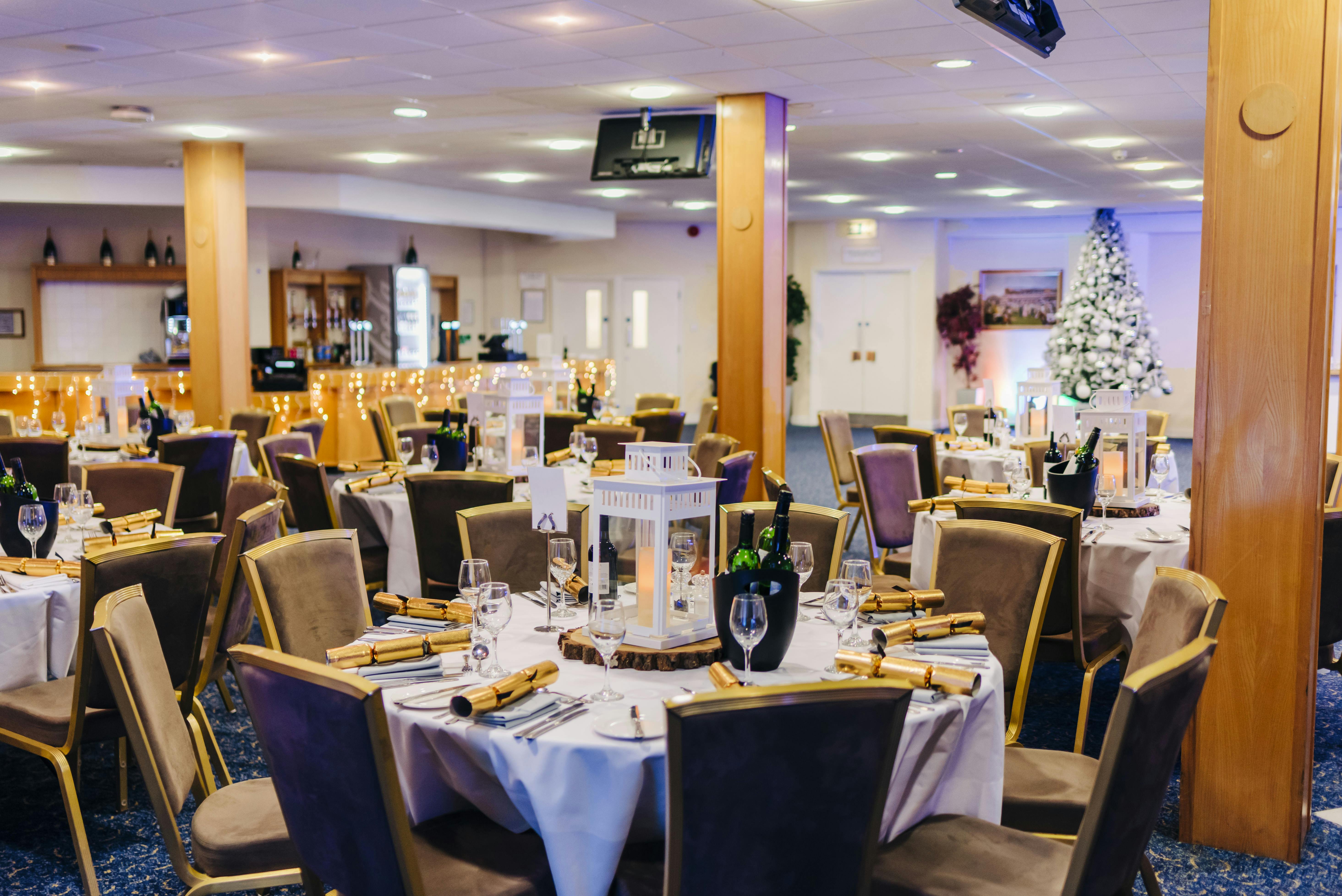 Elegant banquet hall at Kempton Park Racecourse for corporate events and festive gatherings.